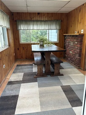 a room with pool table and a large window