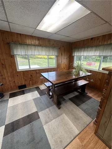 a view of a livingroom with furniture window and wooden floor