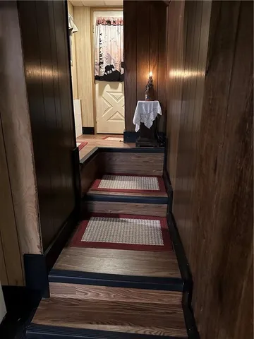 a outdoor space with pool table and chairs