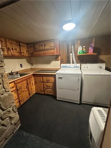 a view of kitchen with refrigerator and window