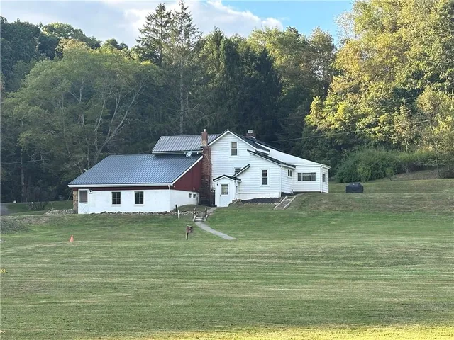 a aerial view of a house with a yard