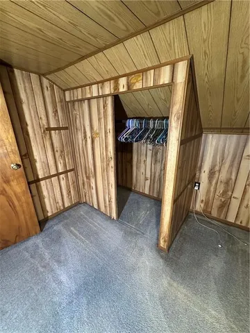 a backyard of a house with yard and outdoor seating