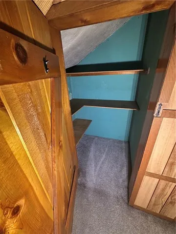 a white toilet sitting next to a bathroom sink