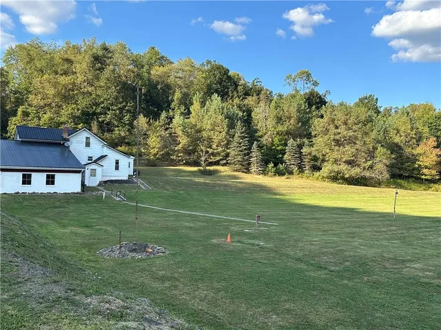 a view of a house with a big yard