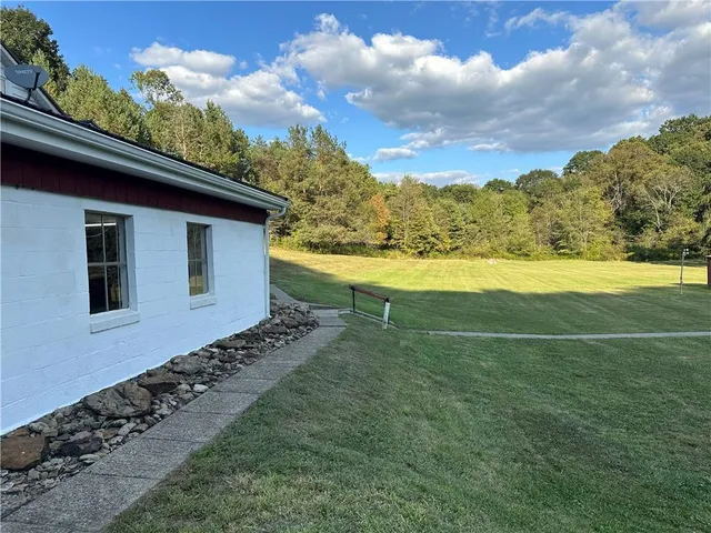 a view of a backyard of the house