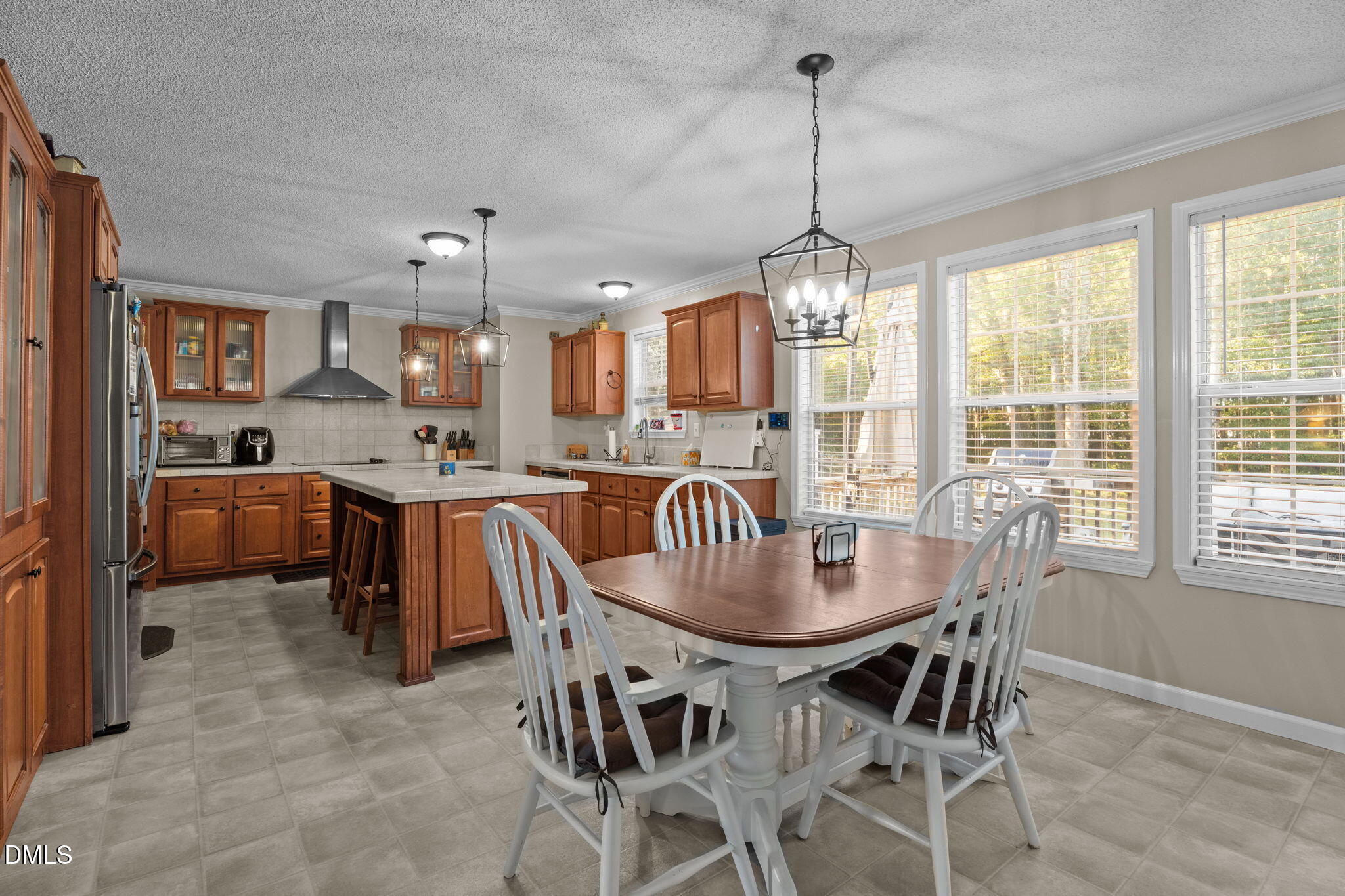 2450 Frazier Road Middlesex, NC 27557 - Photo 16 of 50 a dining room with furniture a chandelier and window