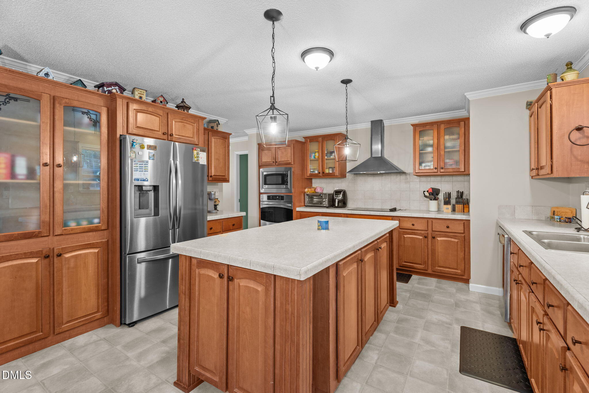 2450 Frazier Road Middlesex, NC 27557 - Photo 18 of 50 a kitchen with stainless steel appliances granite countertop a sink a refrigerator and a stove