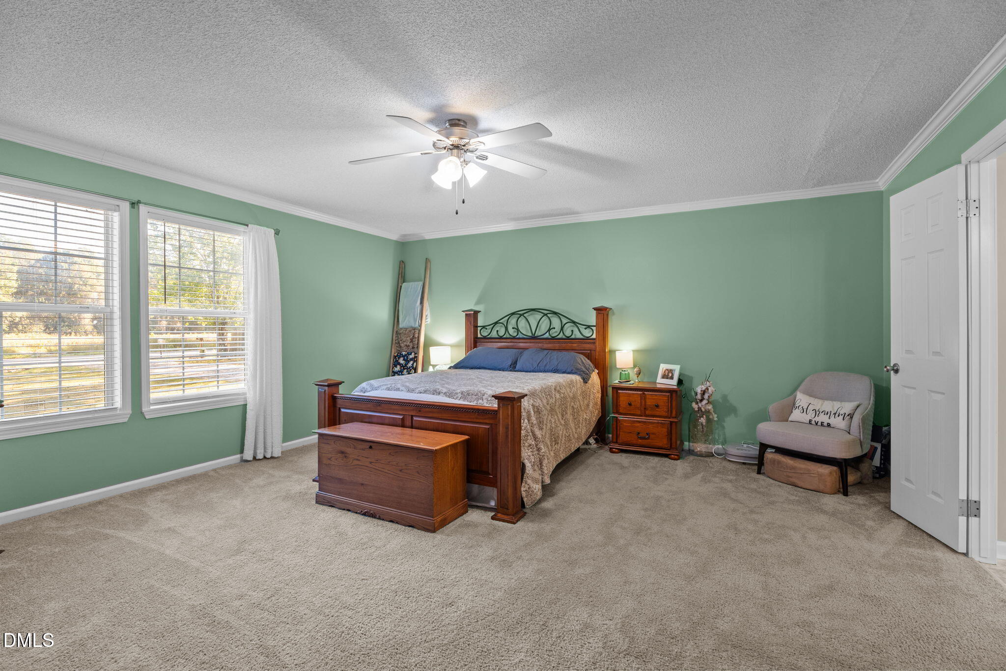 2450 Frazier Road Middlesex, NC 27557 - Photo 23 of 50 a bedroom with a bed and a chandelier