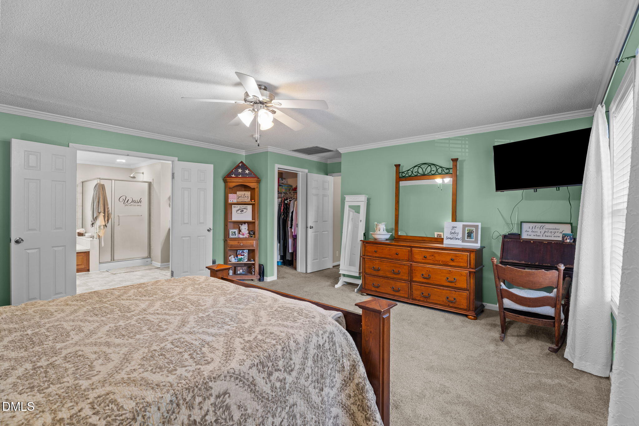 2450 Frazier Road Middlesex, NC 27557 - Photo 25 of 50 a bedroom with a bed and a flat screen tv