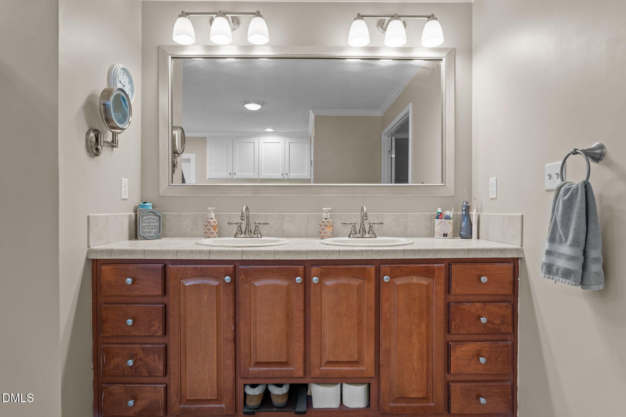 2450 Frazier Road Middlesex, NC 27557 - Photo 28 of 50 a bathroom with a double vanity sink and a mirror