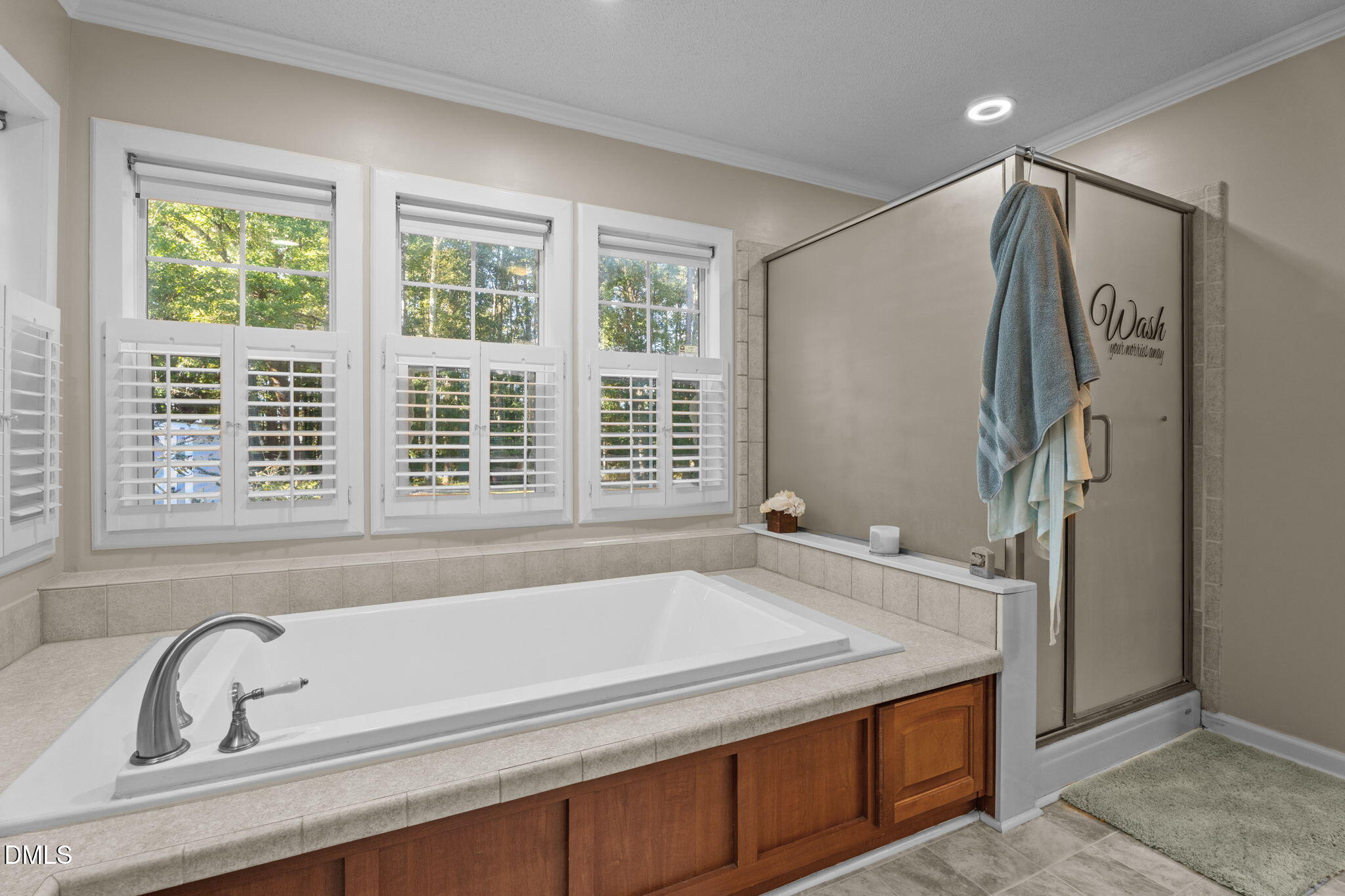 2450 Frazier Road Middlesex, NC 27557 - Photo 29 of 50 a bathroom with bathtub and window