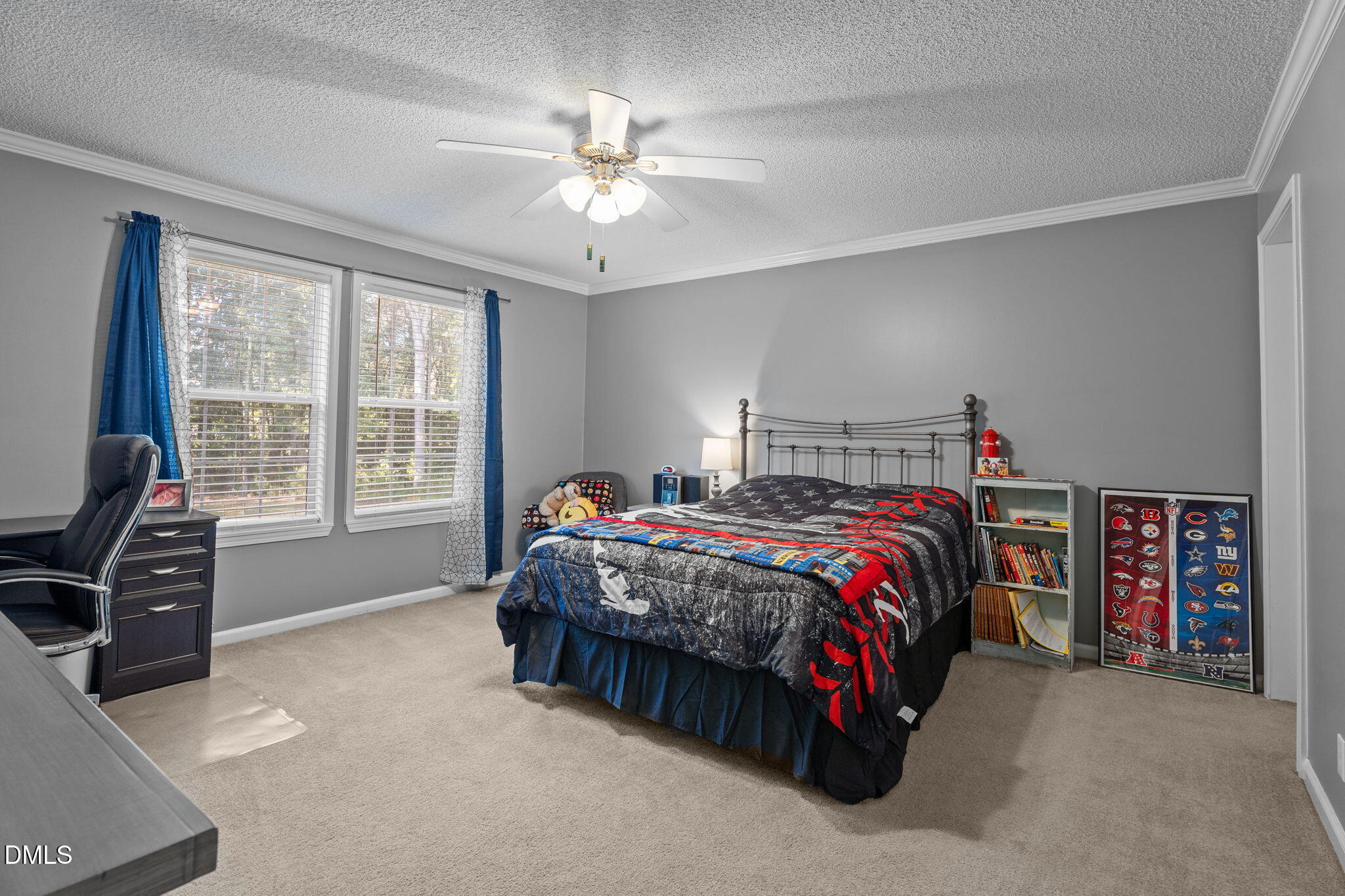 2450 Frazier Road Middlesex, NC 27557 - Photo 31 of 50 a bedroom with a bed and a chandelier