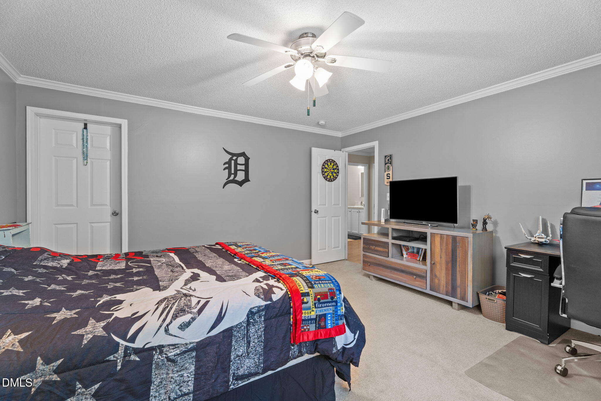 2450 Frazier Road Middlesex, NC 27557 - Photo 32 of 50 a bedroom with a bed and a flat screen tv