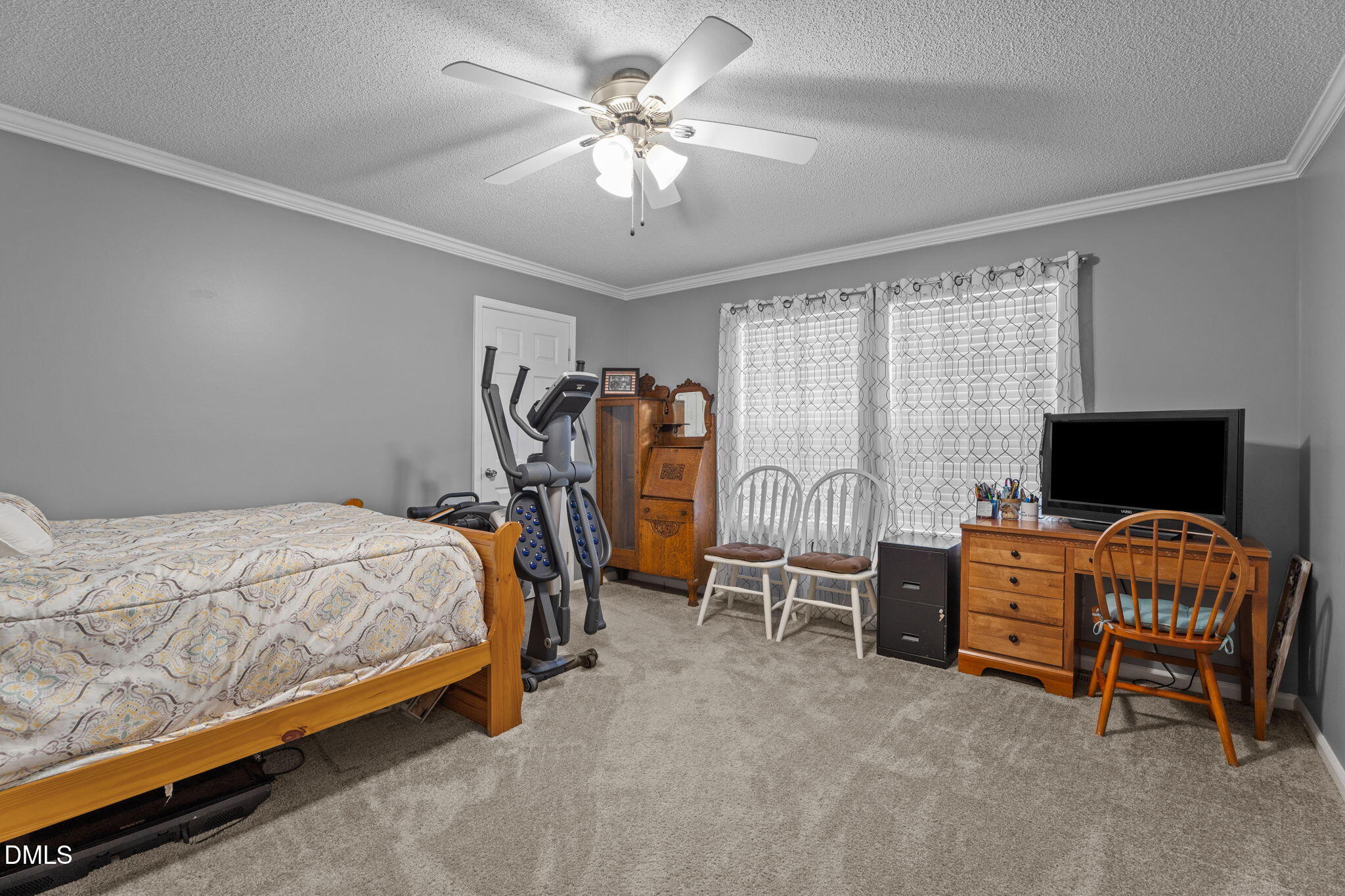 2450 Frazier Road Middlesex, NC 27557 - Photo 33 of 50 a bedroom with bed and a chandelier