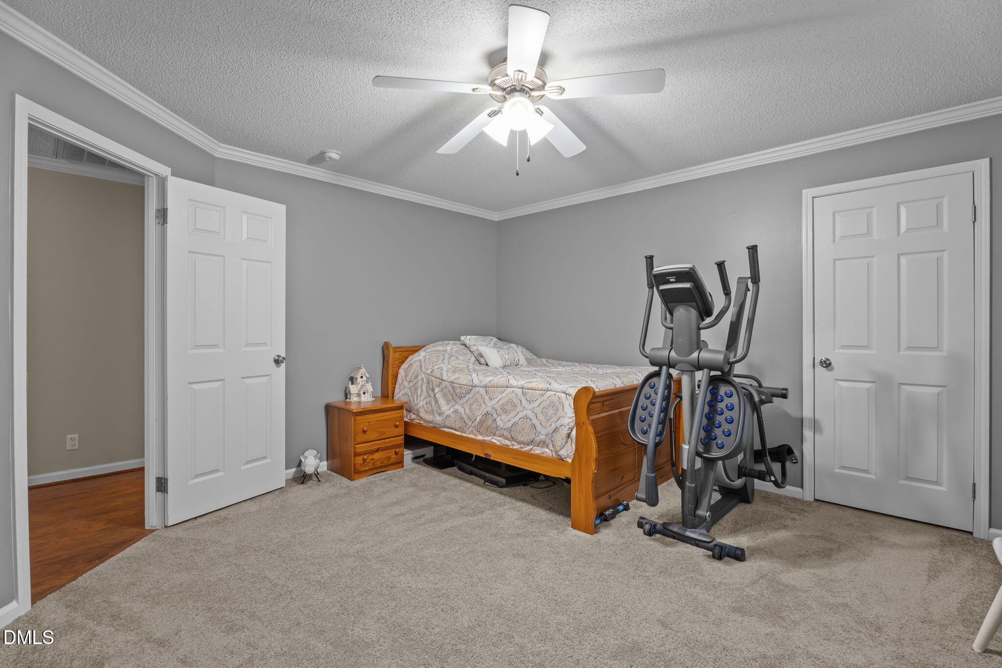 2450 Frazier Road Middlesex, NC 27557 - Photo 34 of 50 a bedroom with bed and a chandelier