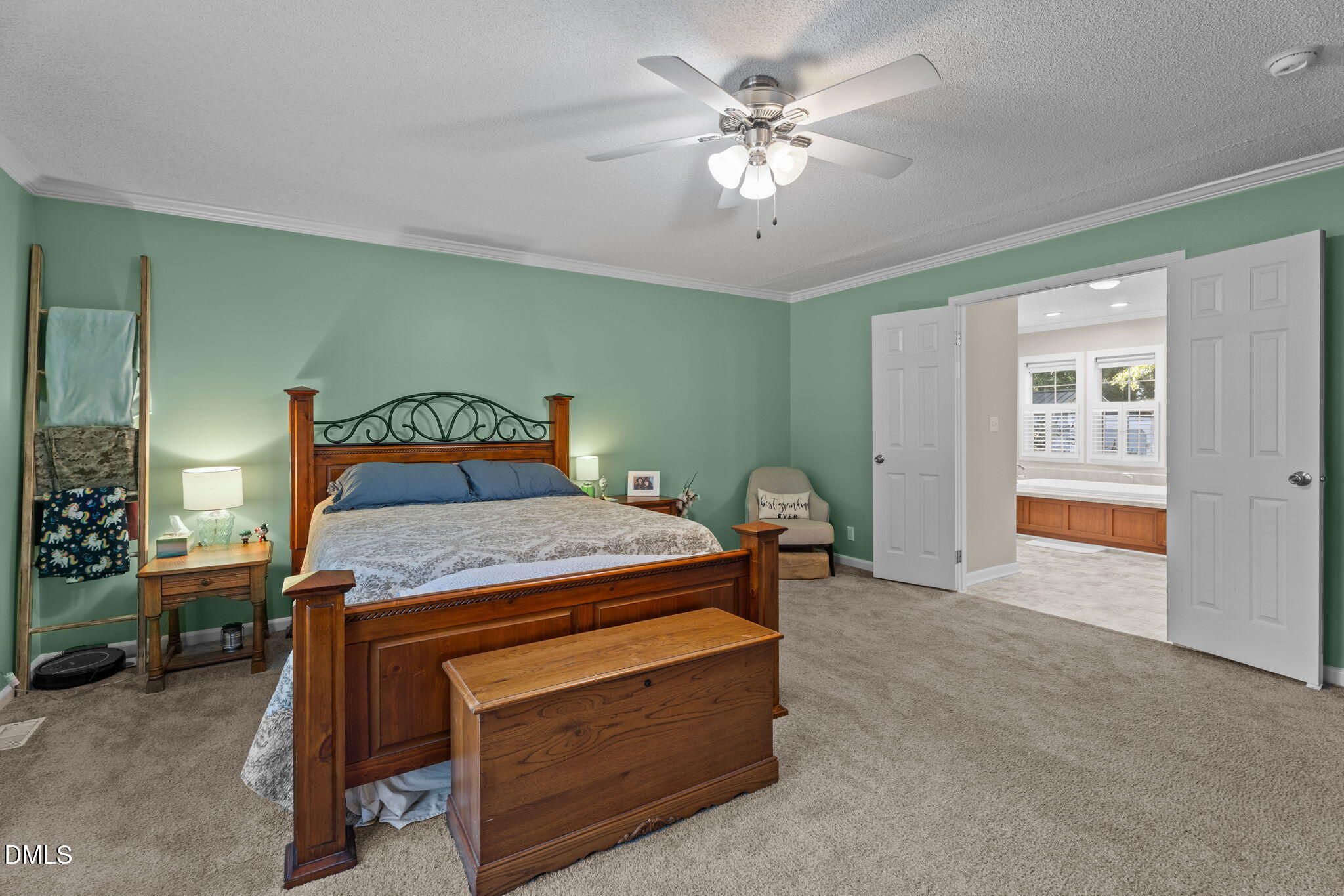 2450 Frazier Road Middlesex, NC 27557 - Photo 39 of 50 a bedroom with a bed and a chandelier