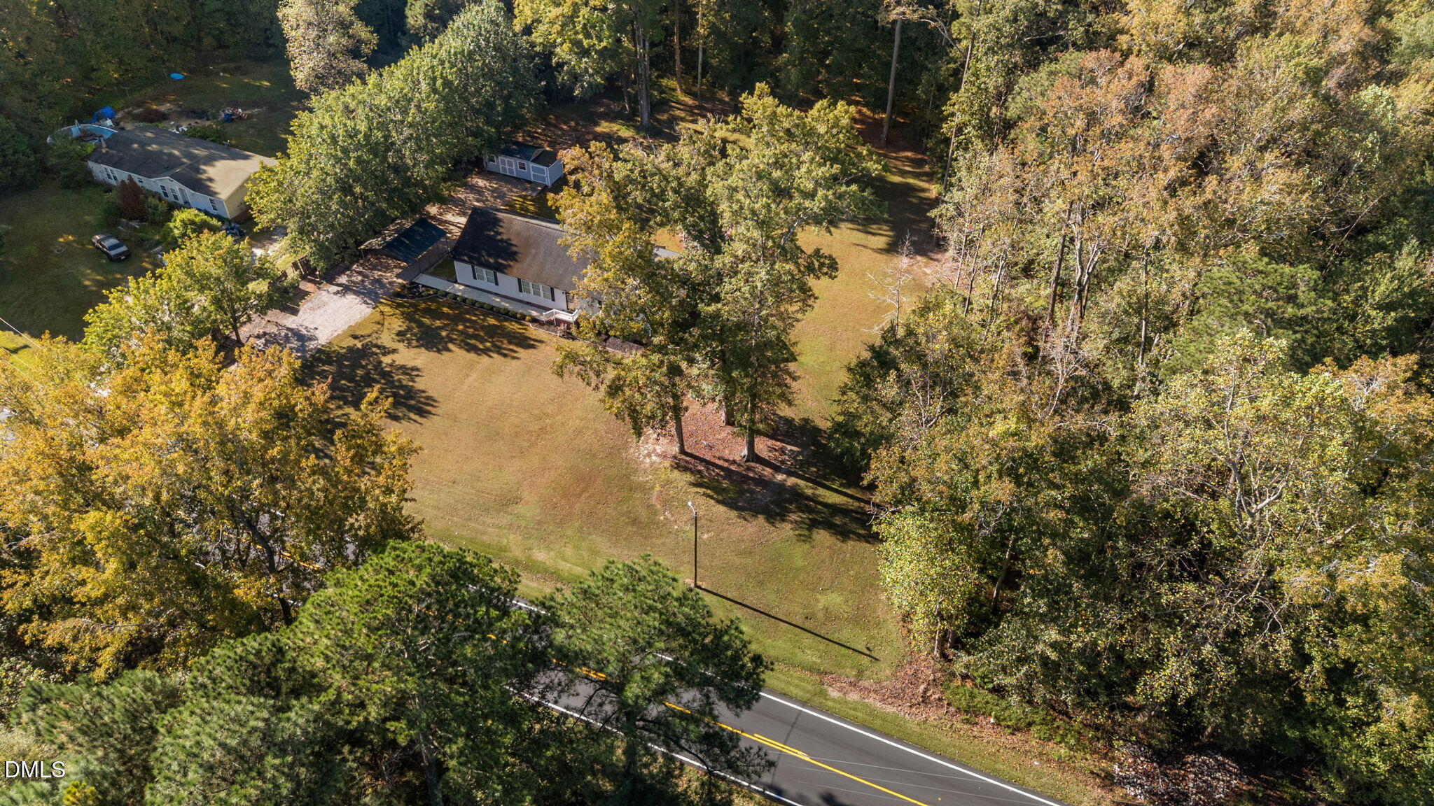 2450 Frazier Road Middlesex, NC 27557 - Photo 43 of 50 a bird view of water house with trees all around