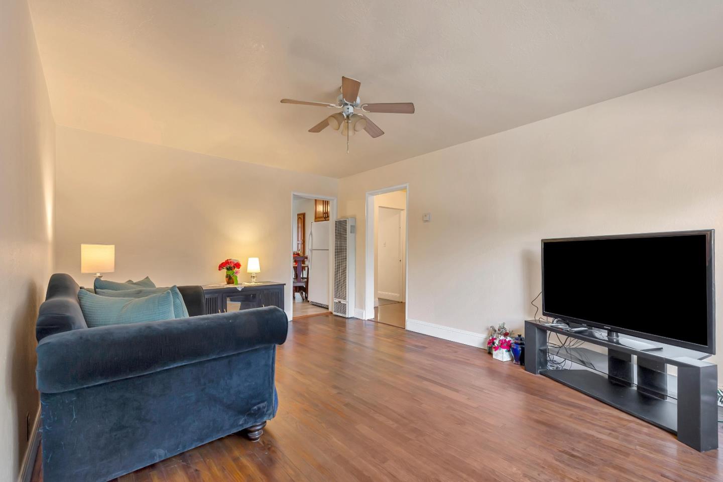 230 Semicircular Road Menlo Park, CA 94025 - Photo 3 of 41 a living room with furniture and a flat screen tv