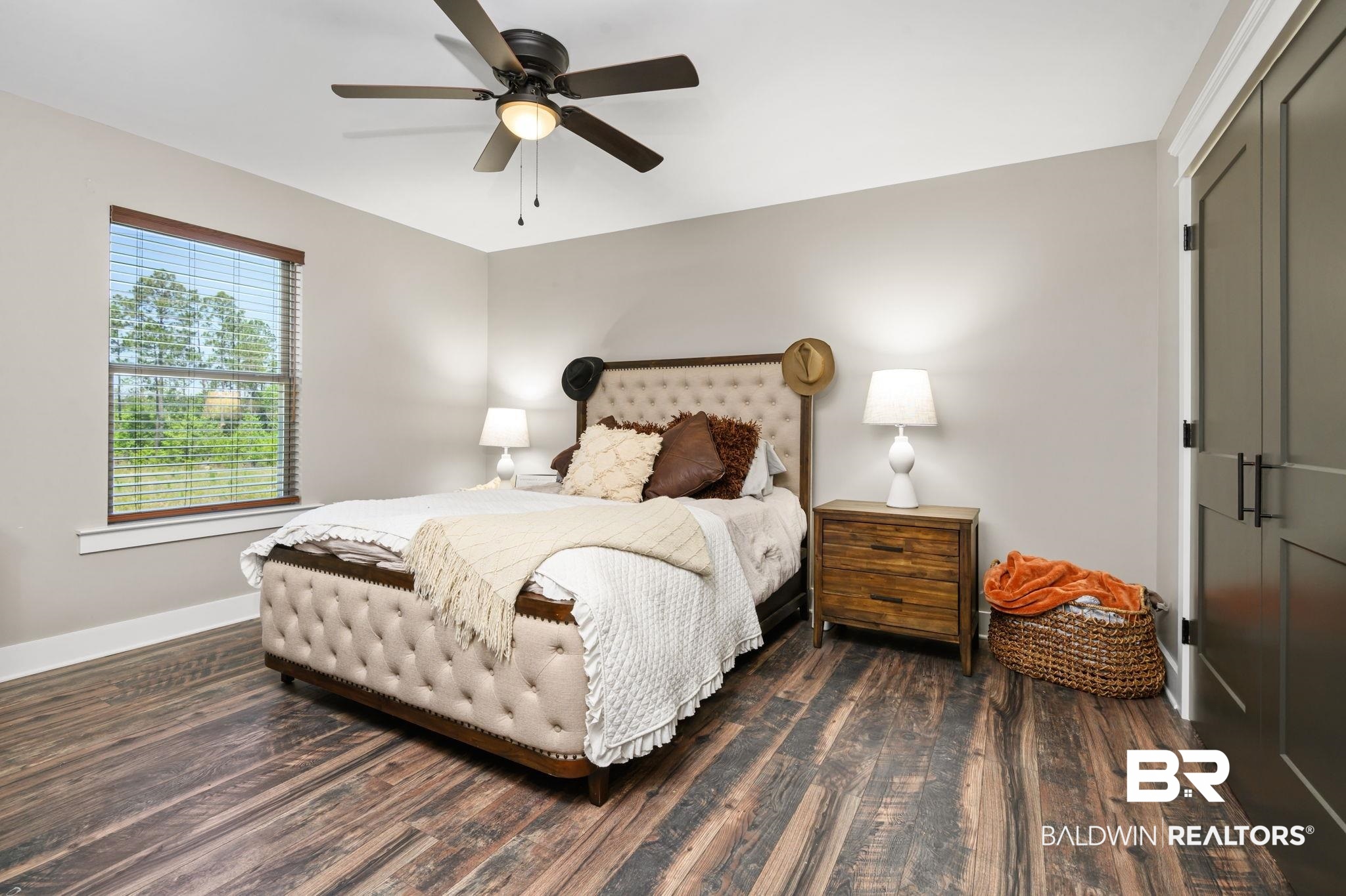 11025 Creax Road Axis, AL 36505 - Photo 31 of 45 Bedroom featuring wood-finish flooring, a ceiling fan with integrated lighting, and a window with blinds