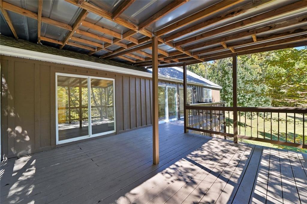 1512 Upper Sassafras Road Jasper, GA 30143 - Photo 8 of 41 a view of a porch with wooden floor and outdoor space