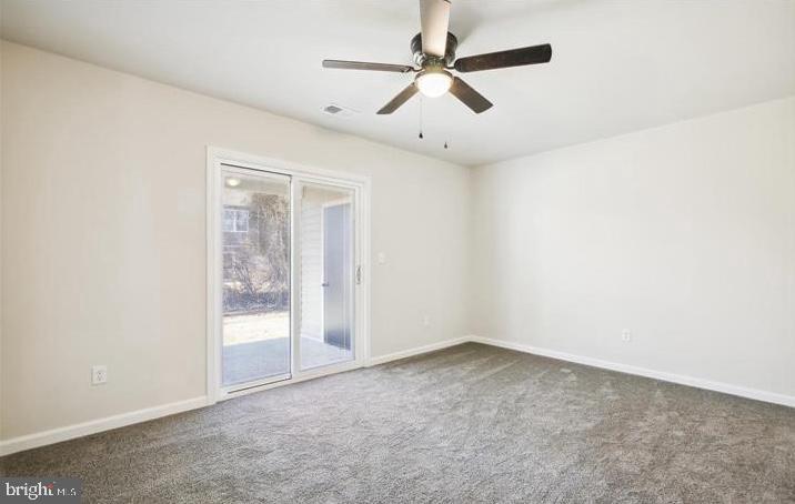 100 Metcalf Road Chestertown, MD 21620 - Photo 13 of 16 an empty room with a ceiling fan and carpet