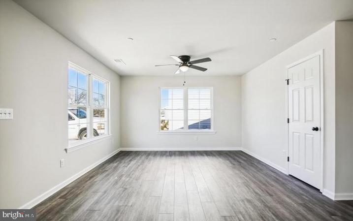 100 Metcalf Road Chestertown, MD 21620 - Photo 14 of 16 an empty room with wooden floor and windows