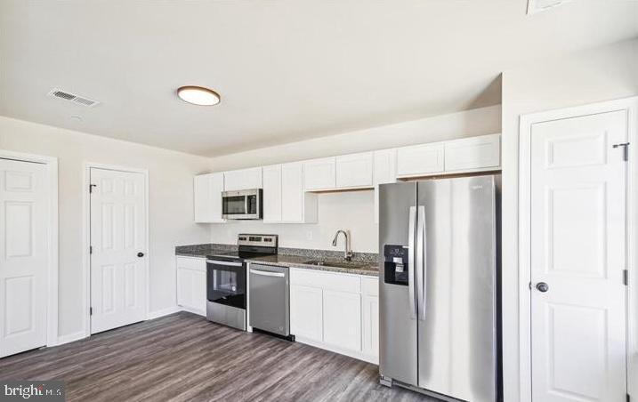 100 Metcalf Road Chestertown, MD 21620 - Photo 6 of 16 a kitchen with stainless steel appliances a refrigerator and white cabinets