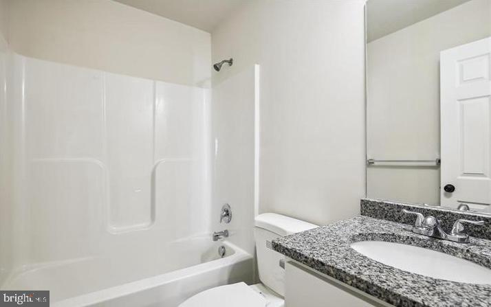 100 Metcalf Road Chestertown, MD 21620 - Photo 9 of 16 a bathroom with a granite countertop sink and a mirror
