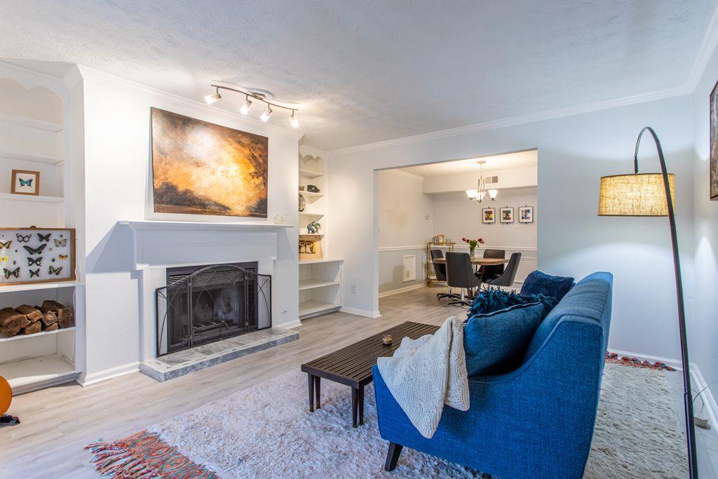 1975 Brian Way Decatur, GA 30033 - Photo 1 of 1 a living room with furniture and a fireplace