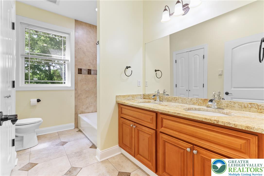 1007 Hampstead Road Bushkill, PA 18324 - Photo 28 of 72 Granite counters and double vanity highlight this well-appointed bathroom.