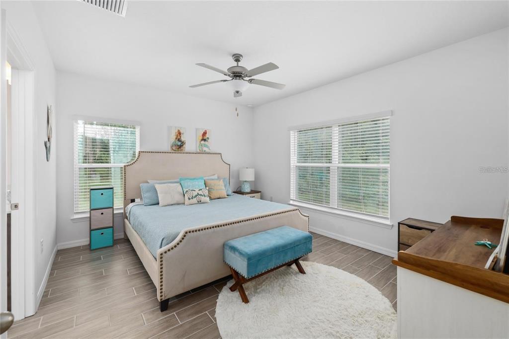 37 Ullman Place, Unit A Palm Coast, FL 32164 - Photo 11 of 20 a bedroom with a bed and a window