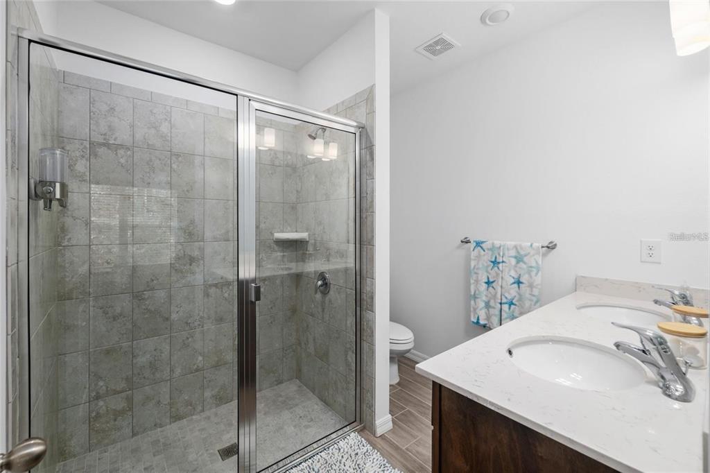 37 Ullman Place, Unit A Palm Coast, FL 32164 - Photo 13 of 20 a bathroom with a sink and a mirror
