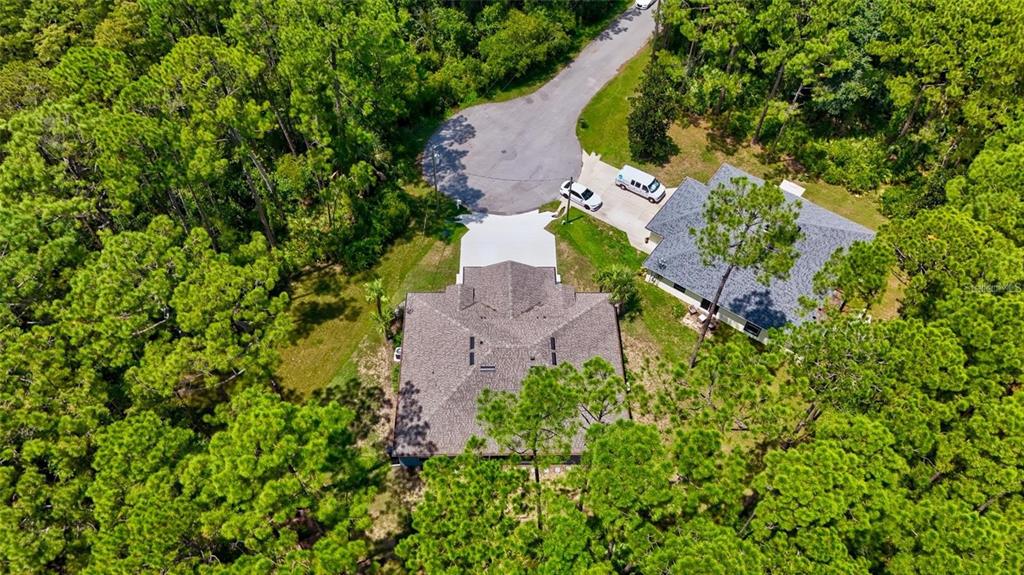 37 Ullman Place, Unit A Palm Coast, FL 32164 - Photo 19 of 20 an aerial view of residential house with outdoor space and trees all around