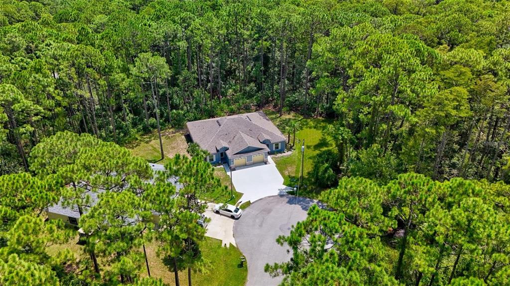37 Ullman Place, Unit A Palm Coast, FL 32164 - Photo 3 of 20 an aerial view of a house with yard and outdoor seating