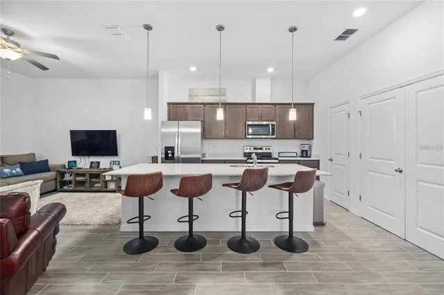 a kitchen with lots of counter space furniture and kitchen view