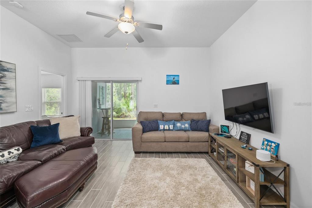 37 Ullman Place, Unit A Palm Coast, FL 32164 - Photo 9 of 20 a living room with furniture and a flat screen tv
