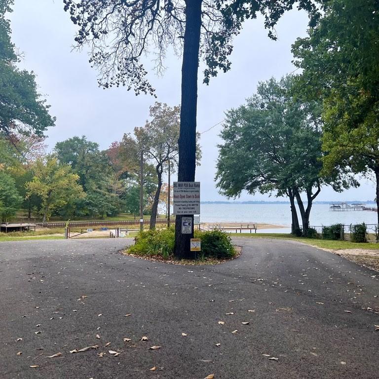 0 Glen Oaks Road Mabank, TX 75156 - Photo 2 of 2 a view of a street with a building and trees in the background