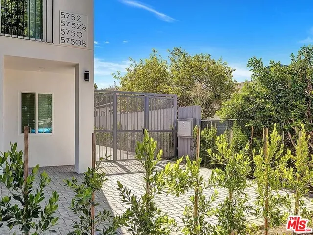 a view of a backyard with plants