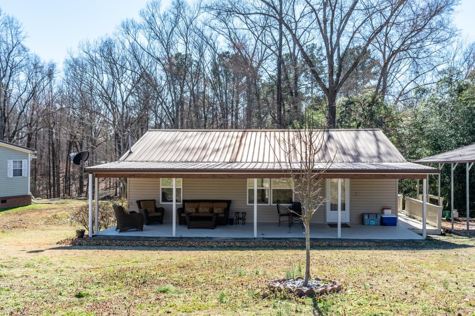 60 Bluebird Road Counce, TN 38326 - Photo 21 of 22 a view of a house with swimming pool and sitting area