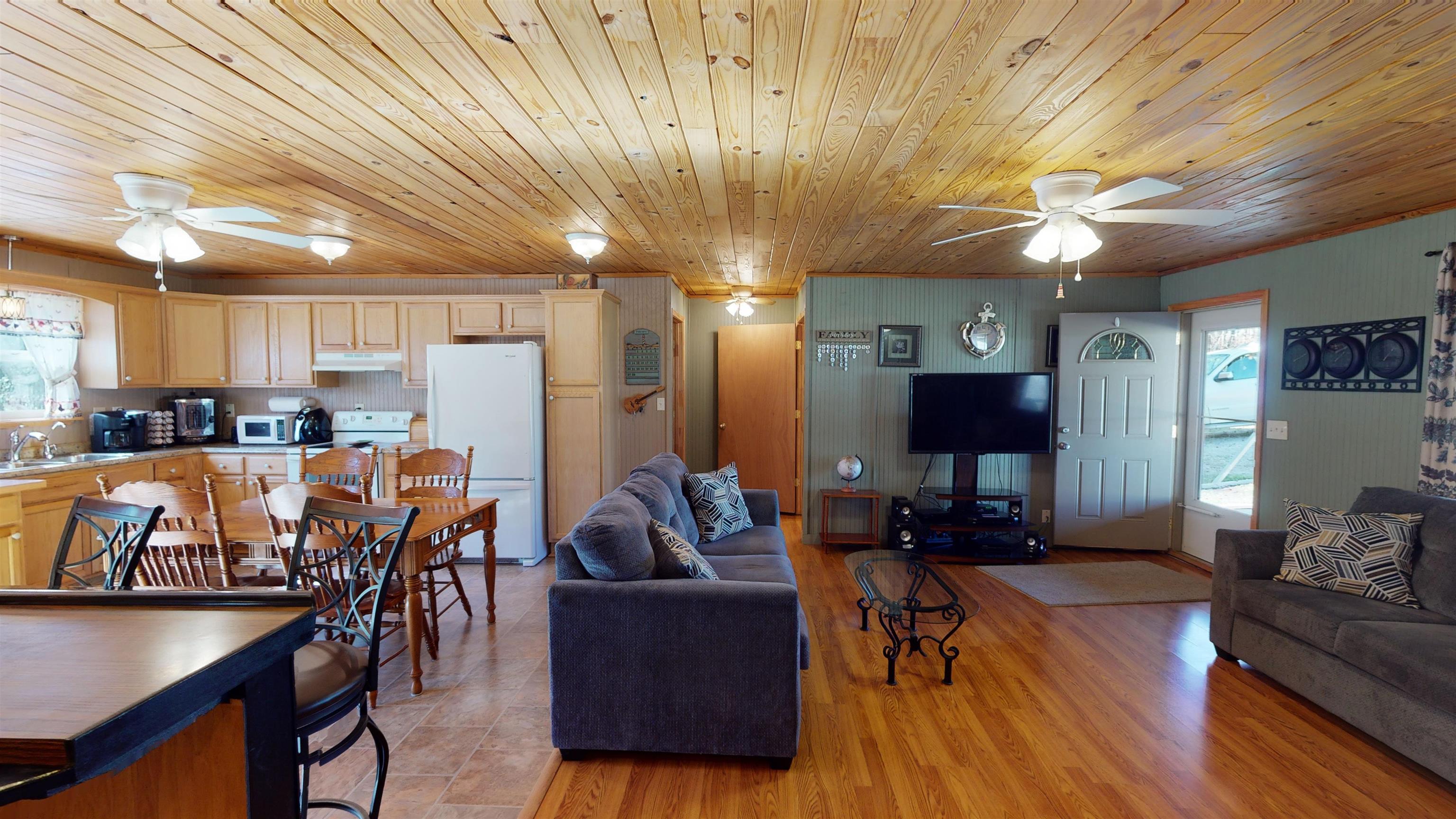 60 Bluebird Road Counce, TN 38326 - Photo 3 of 22 a living room with lots of furniture and kitchen view