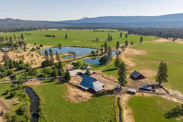 an aerial view of a house with a garden