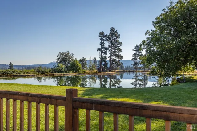 a view of a lake with houses with outdoor space