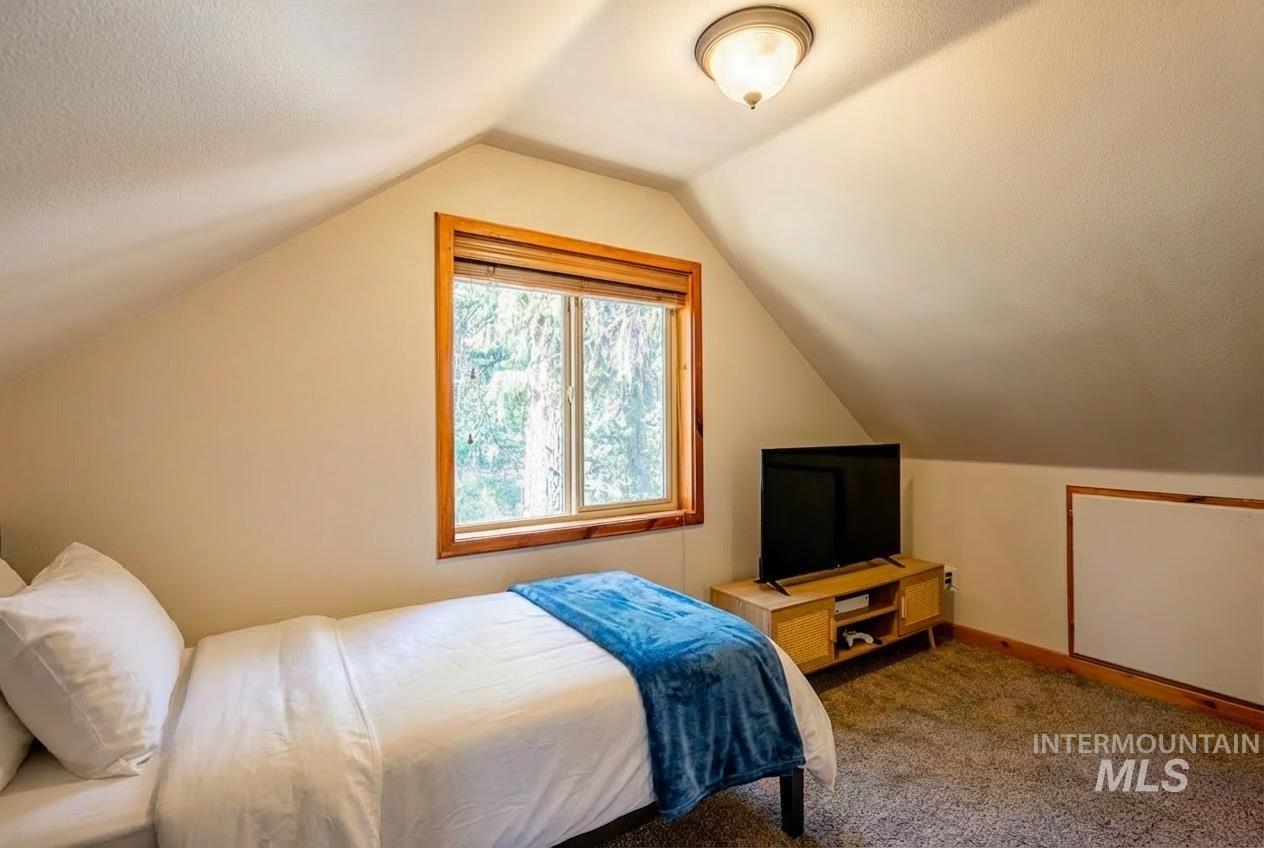 1409 Paul Bunyan Road McCall, ID 83638 - Photo 11 of 16 Carpeted bedroom featuring baseboards