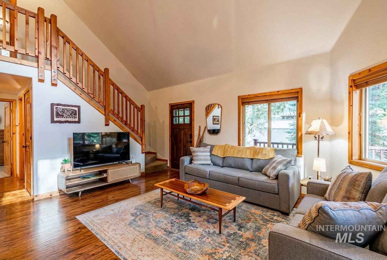 1409 Paul Bunyan Road McCall, ID 83638 - Photo 4 of 16 Living room with lofted ceiling, hardwood / wood-style flooring, and plenty of natural light