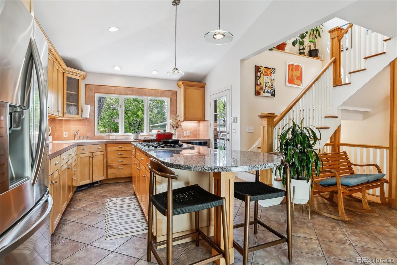 1377 Cherry Street Denver, CO 80220 - Photo 15 of 50 a kitchen with granite countertop lots of counter top space
