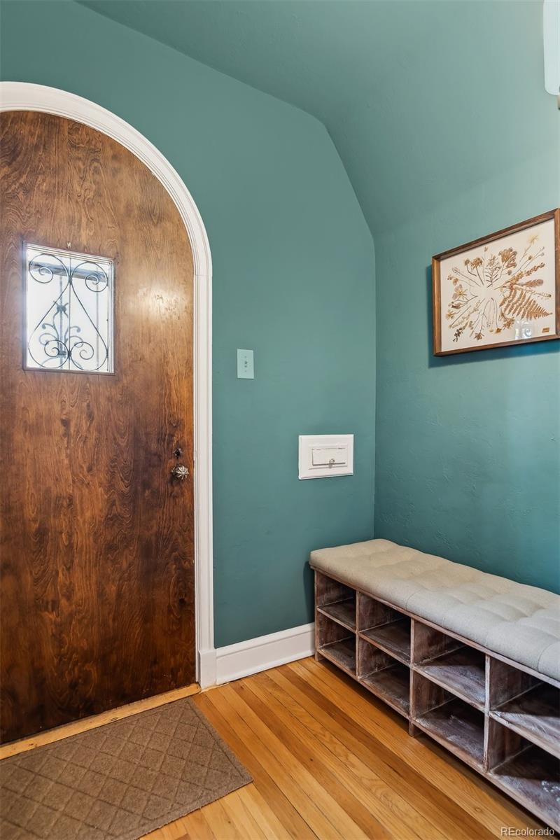 1377 Cherry Street Denver, CO 80220 - Photo 4 of 50 a bedroom with a bed and a wall painting