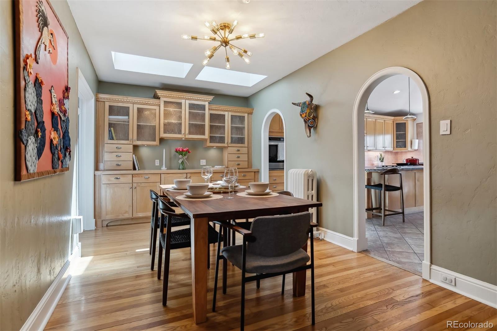 1377 Cherry Street Denver, CO 80220 - Photo 9 of 50 a view of a dining room with furniture window and wooden floor