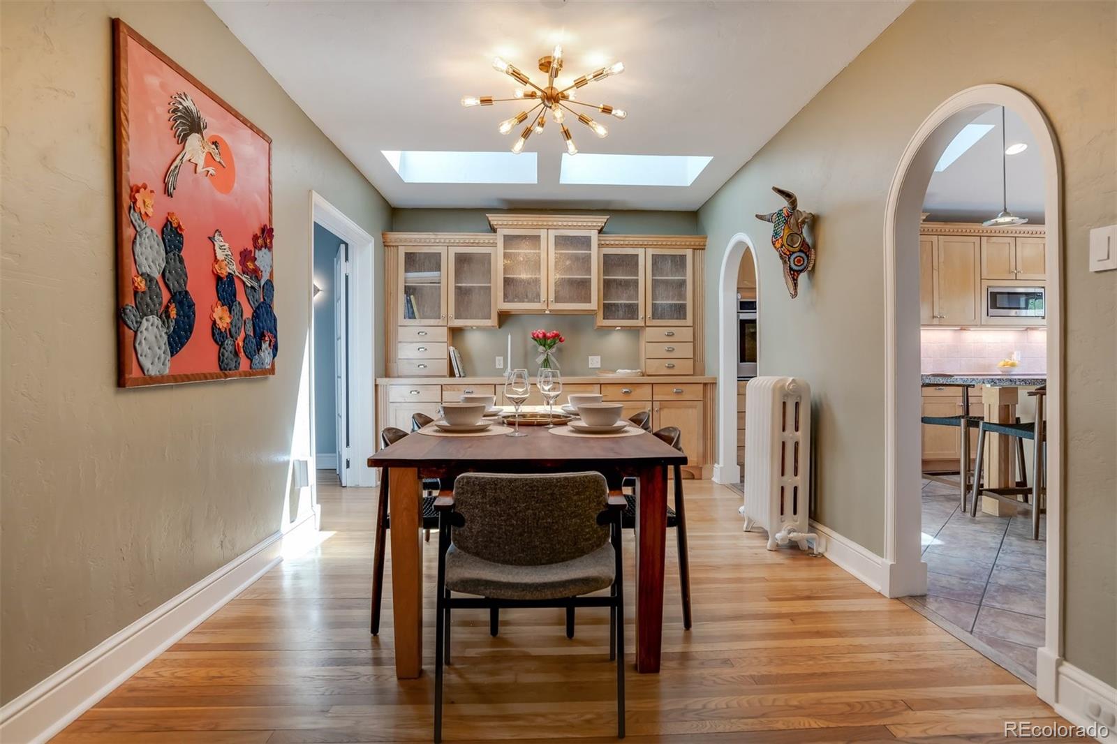 1377 Cherry Street Denver, CO 80220 - Photo 10 of 50 a view of a dining room with furniture wooden floor and chandelier