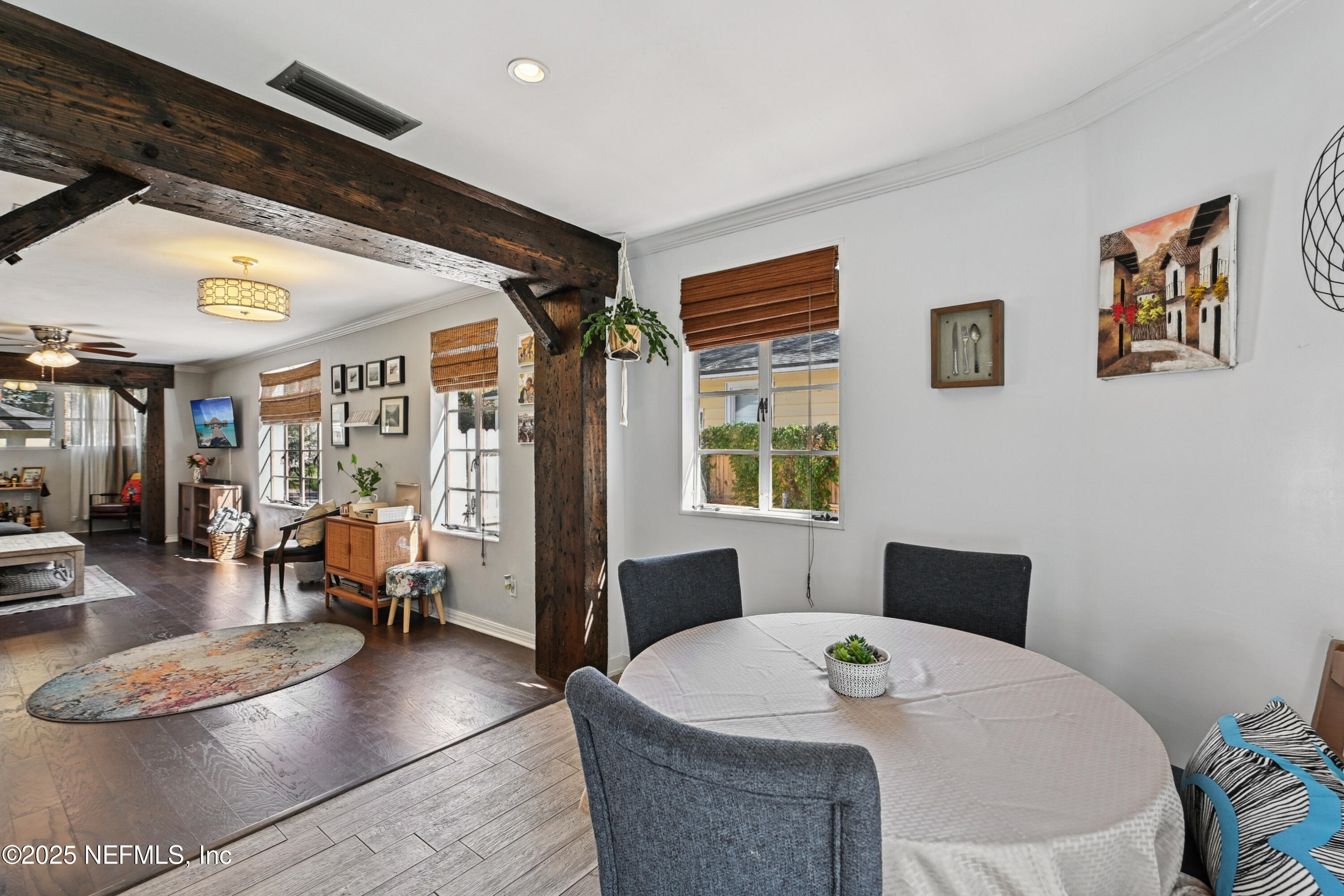 1316 Rensselaer Avenue Jacksonville, FL 32205 - Photo 11 of 46 a living room with furniture a large window and a dining table