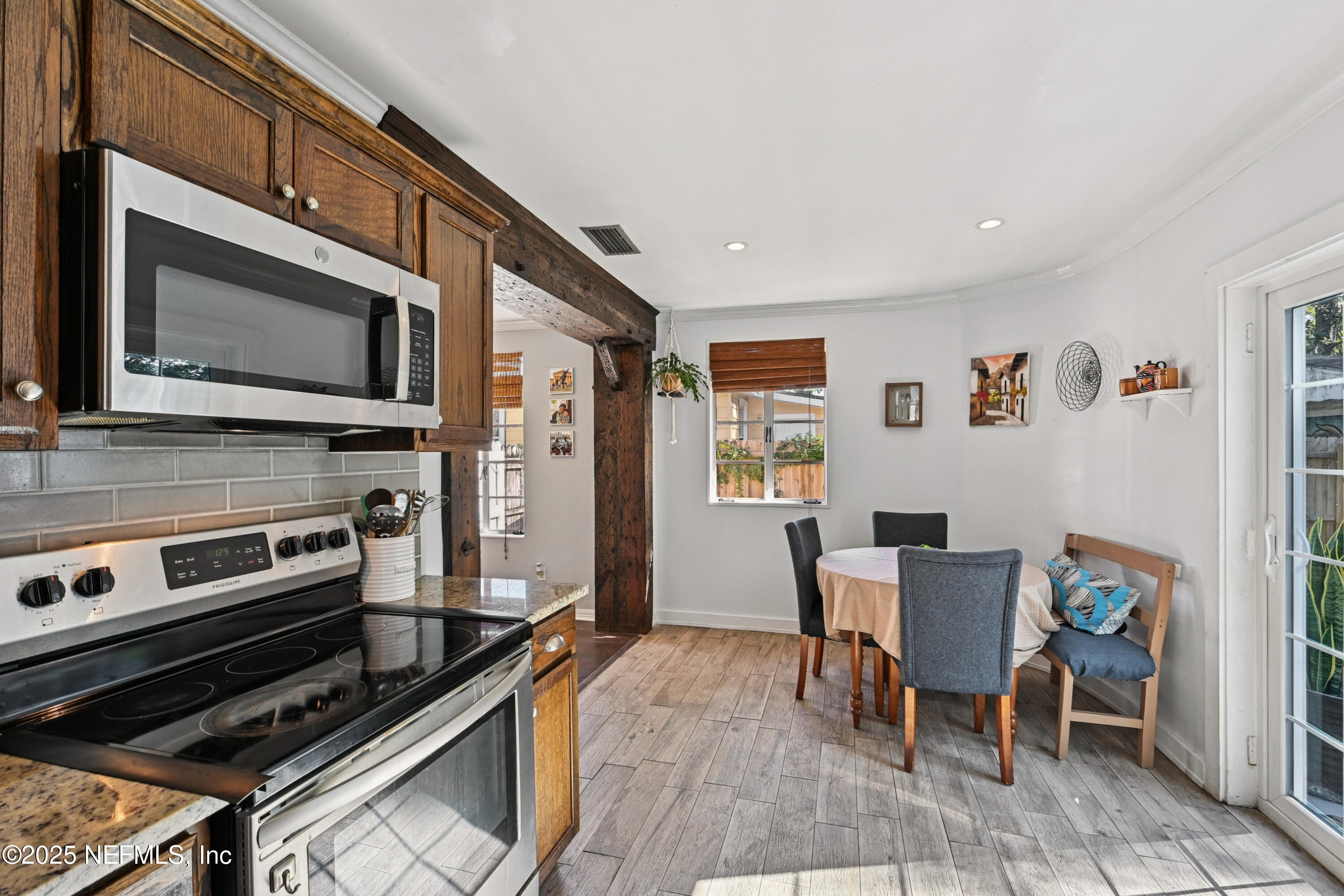 1316 Rensselaer Avenue Jacksonville, FL 32205 - Photo 13 of 46 a kitchen with a stove and a microwave